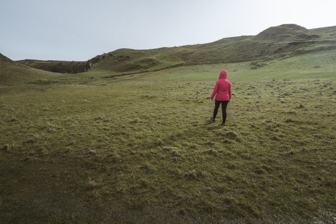 Woman walking along mountain