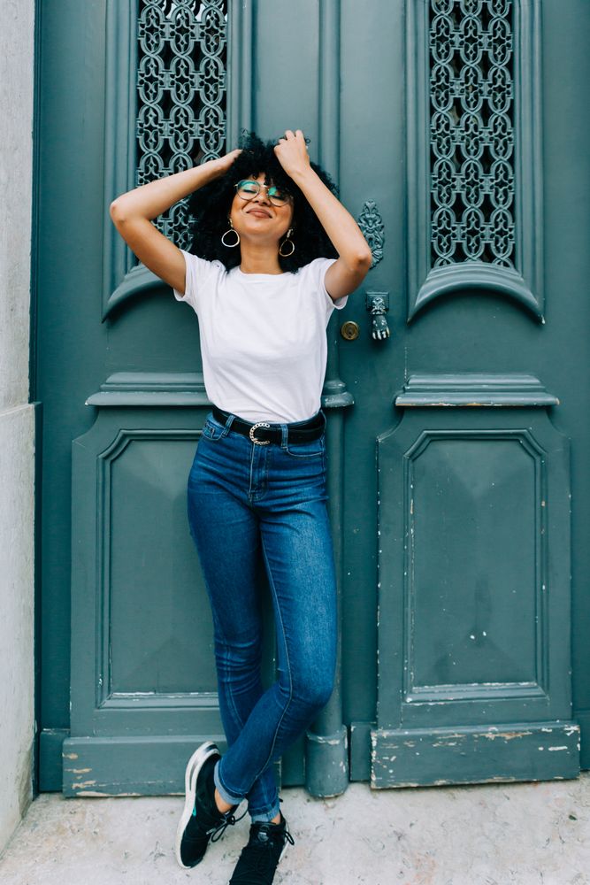 Stylish female by green door