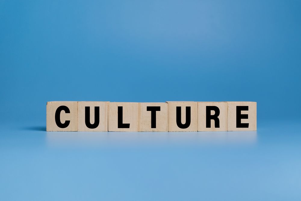 culture word text on wooden blocks isolated on blue background