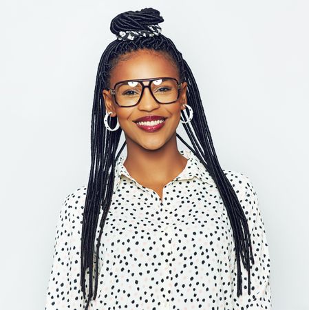 Portrait of confident and fashionable woman wearing glasses