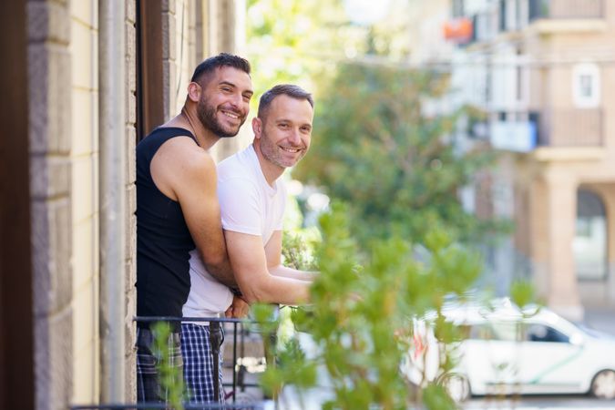 Two men standing on their patio together