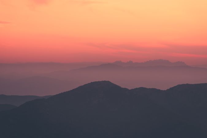 Sunset sky over mountain ridge