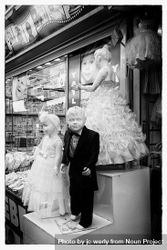 B&W shot of child mannequins in formal wear 4Mkrz0