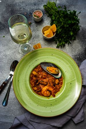 Risotto with sea food served with chill wine and lemon