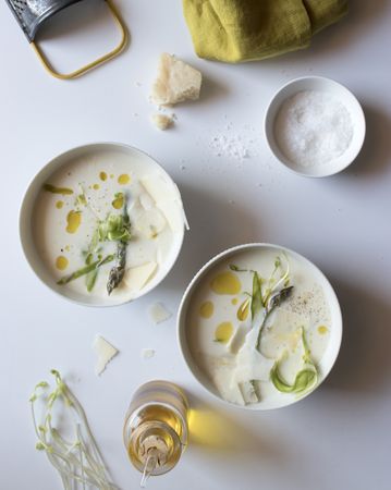 Kitchenware and condiments near asparagus cream soup