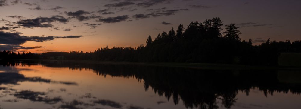 Sunset landscape with river and forest
