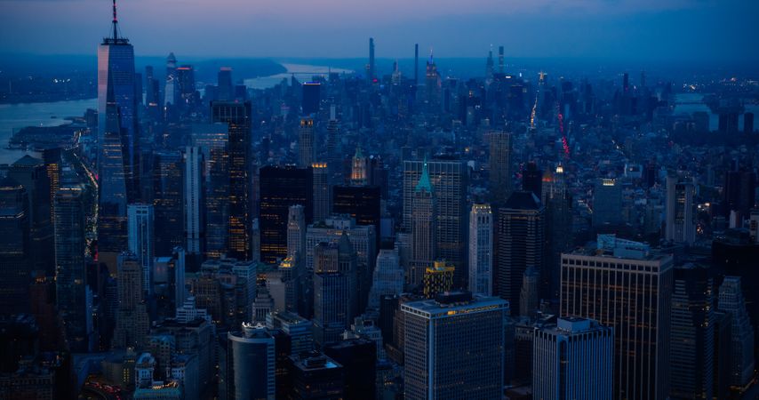 Scenic Aerial New York City View Towards Lower Manhattan Architecture. Panoramic Evening Photo of Wall Street Financial District from a Helicopter. Cityscape with Office Buildings and Skyscrapers