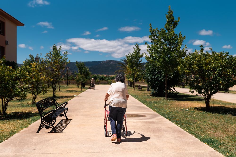 woman with walker on street