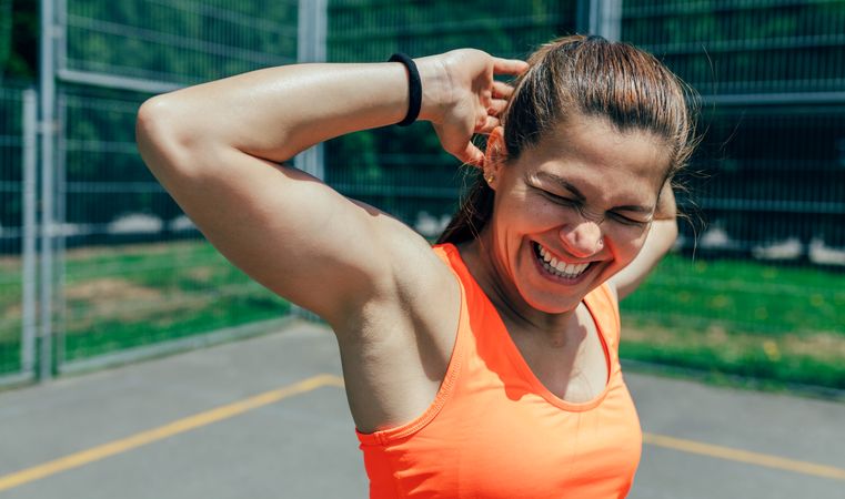 Sportswoman doing arm stretches