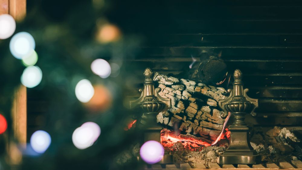Christmas tree and fireplace in the background