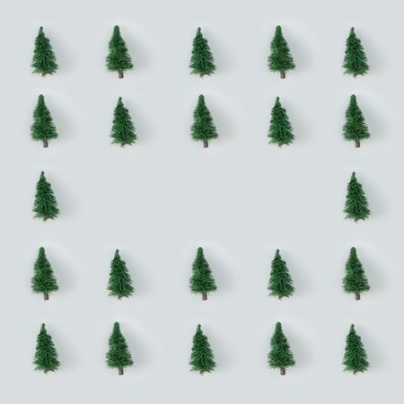 Christmas trees arranged on gray background