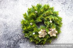 Christmas wreath with decorative stars on marble background 0vxQB4