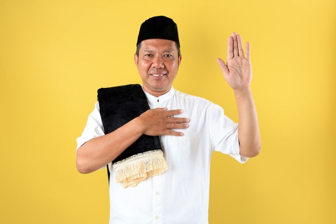 Mature Asian Male Wearing Baju Koko Going to Mosque fro Sholat Jumat Friday Prayer