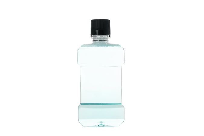 Blank mouthwash bottle isolated on light background