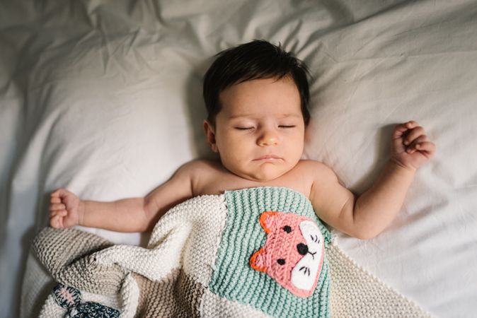 Cute baby sleeping on bed