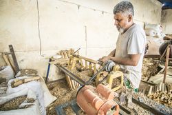 Man using woodworking machine at workplace