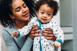 Woman holding her toddler son