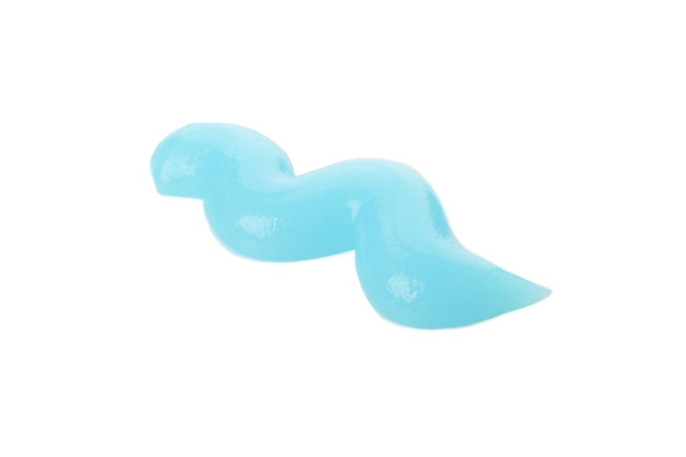 Blue squeezed toothpaste isolated on light background