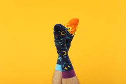 Casual clothes and wearing concept - socks, clothes for foot