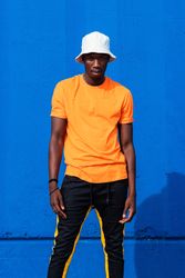 Black man in bright sporty outfit and cap