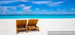 Blue sky over a tropical beach with blue water and sand 5ov380