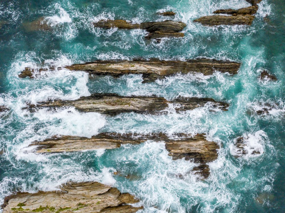 Stone ridges on high seas in stormy day