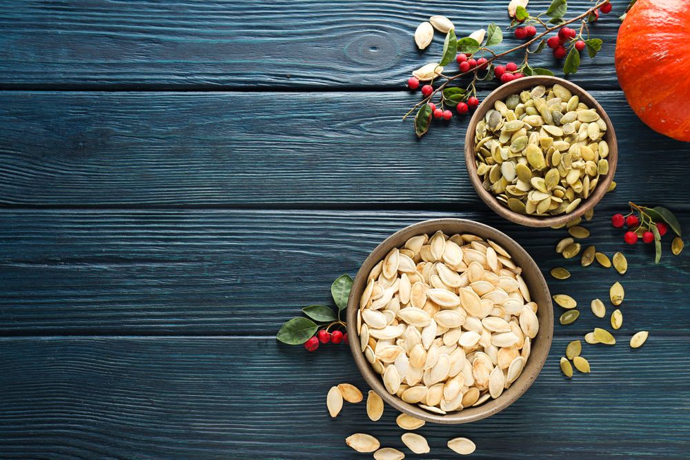 Cooking ingredients for fall season - pumpkin seeds, pumpkin