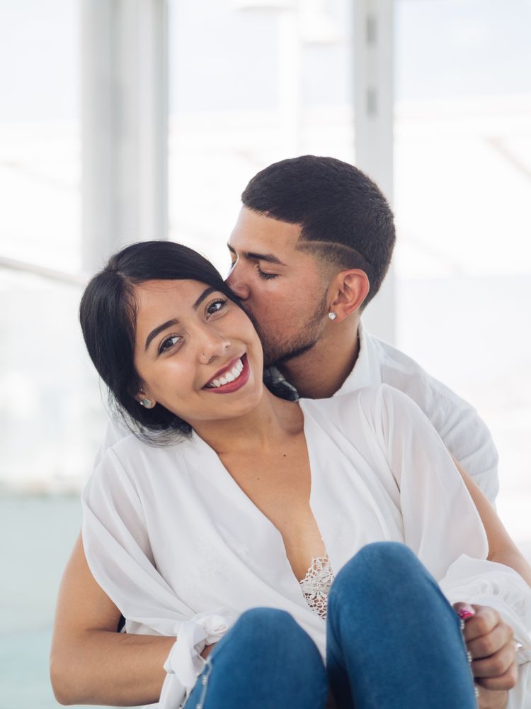 Man embracing smiling woman with love and tenderness