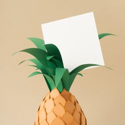 Pineapple made of paper on beige background