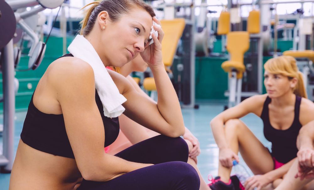 Tired fit woman after workout