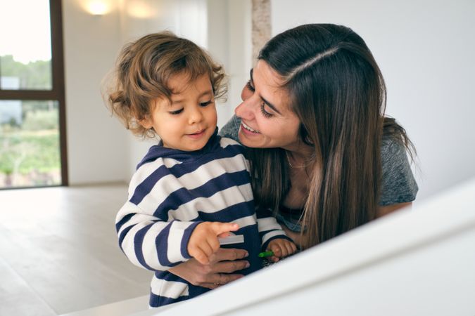 Happy mother talking with adorable son