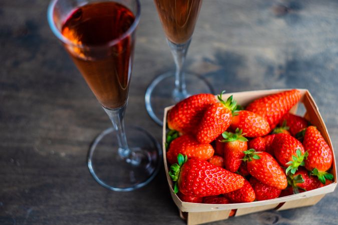 Pink champagne with basket of strawberry