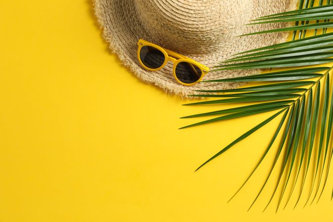 Summer vacation composition on yellow background. Space for text, top view
