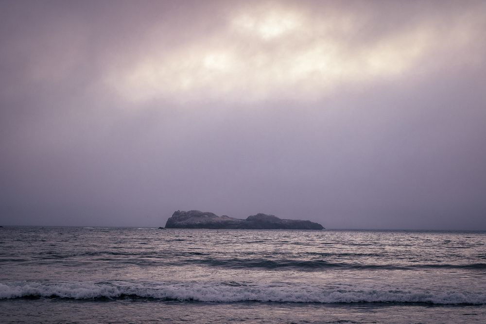 Rock out in the ocean on overcast day