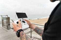 Man with remote for drone camera