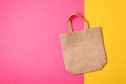 Eco bag on two color background, space for text