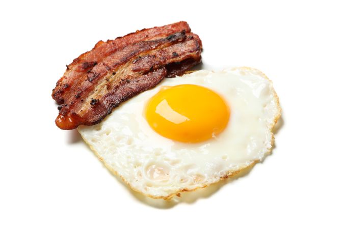 Fried egg on toast with bacon