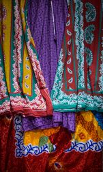 Close up of brightly patterned scarves