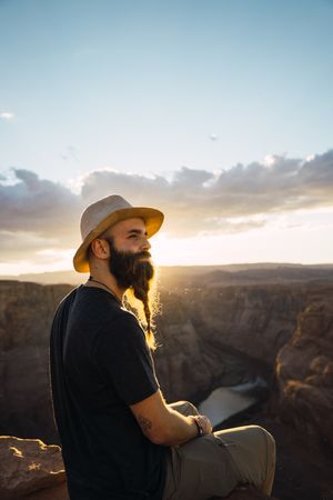 Bearded traveler looking at canyon