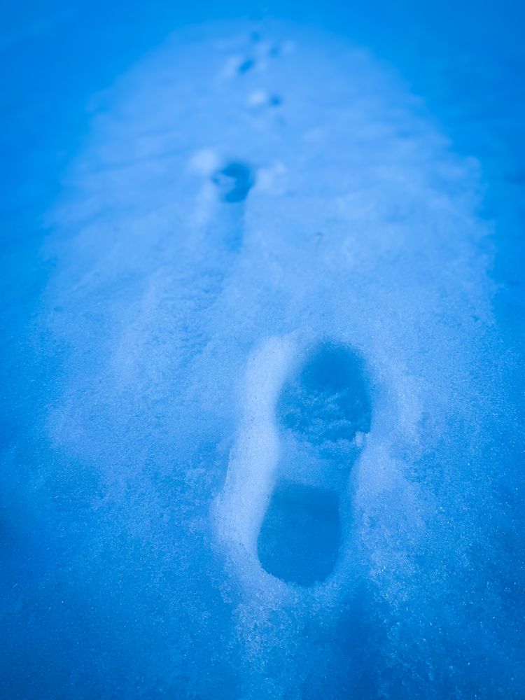 Boot tracks on cold wet snow