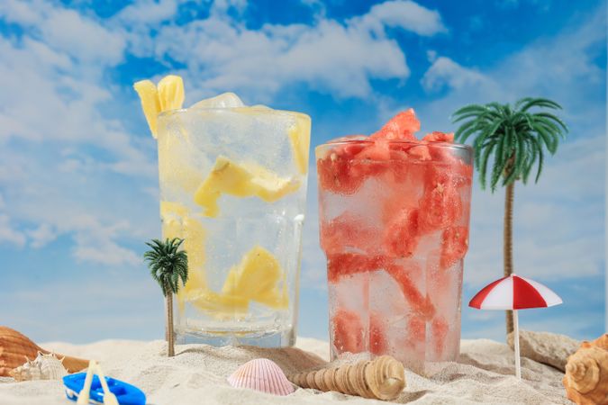 Pineapple and Water Melon Soda on Miniature Beach Holiday Concept