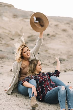 Content blond women cuddling on nature