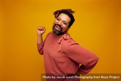Gender fluid male posing on yellow background 56a7Y0