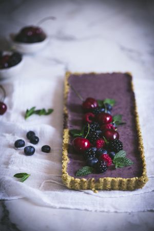 Fresh blueberry pistachio cake with whole berries on top
