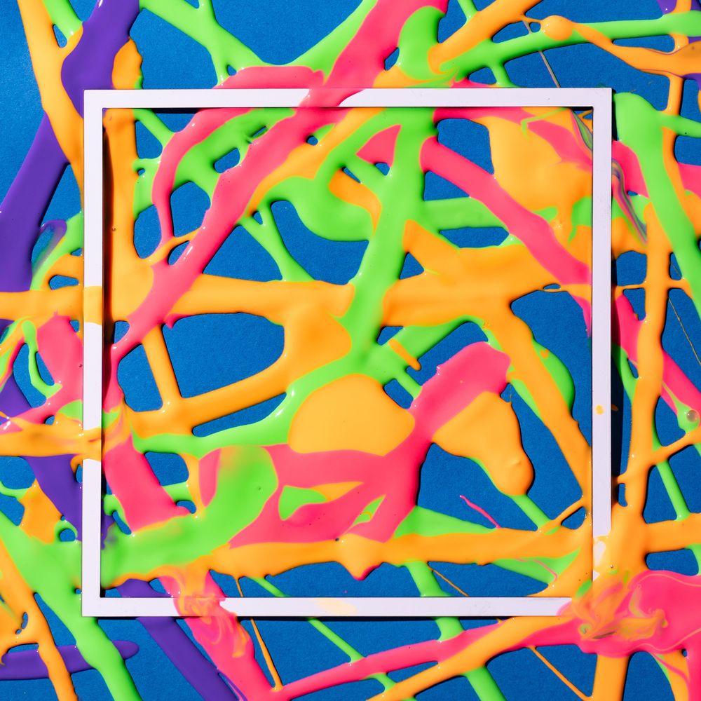 Pattered bright paint on blue background with square outline