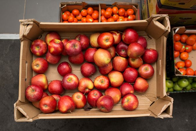 Top view of red apples in brown crate