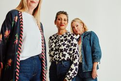 Three stylish older women in studio portrait
