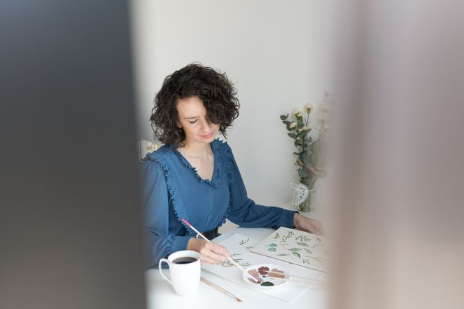 Woman painter working at home