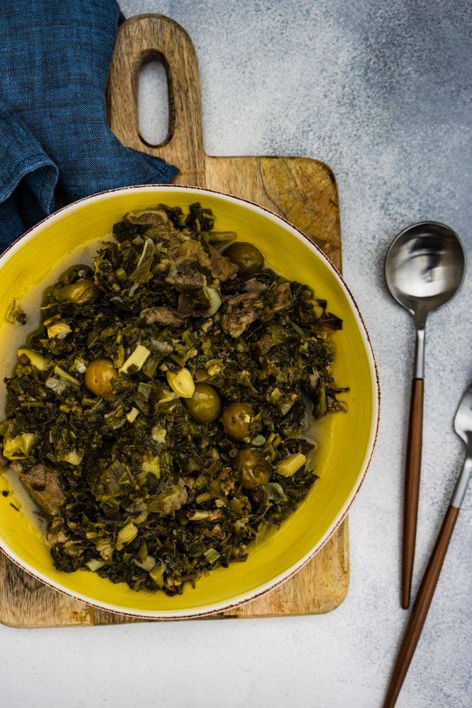 Top view of Chakapuli is a Georgian stew in yellow plate