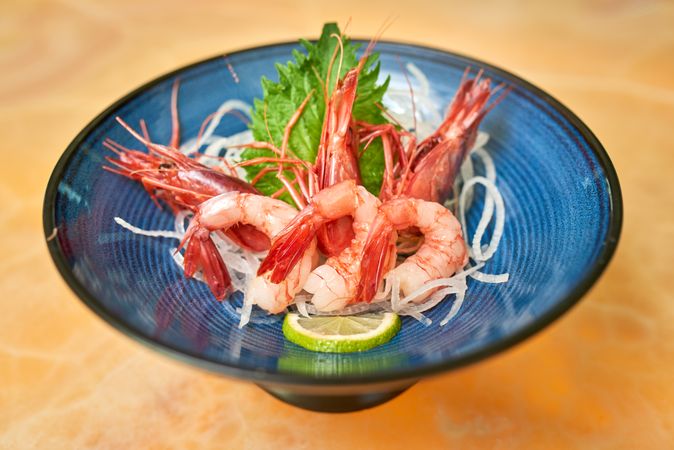 Delectable shrimps served in plate on table